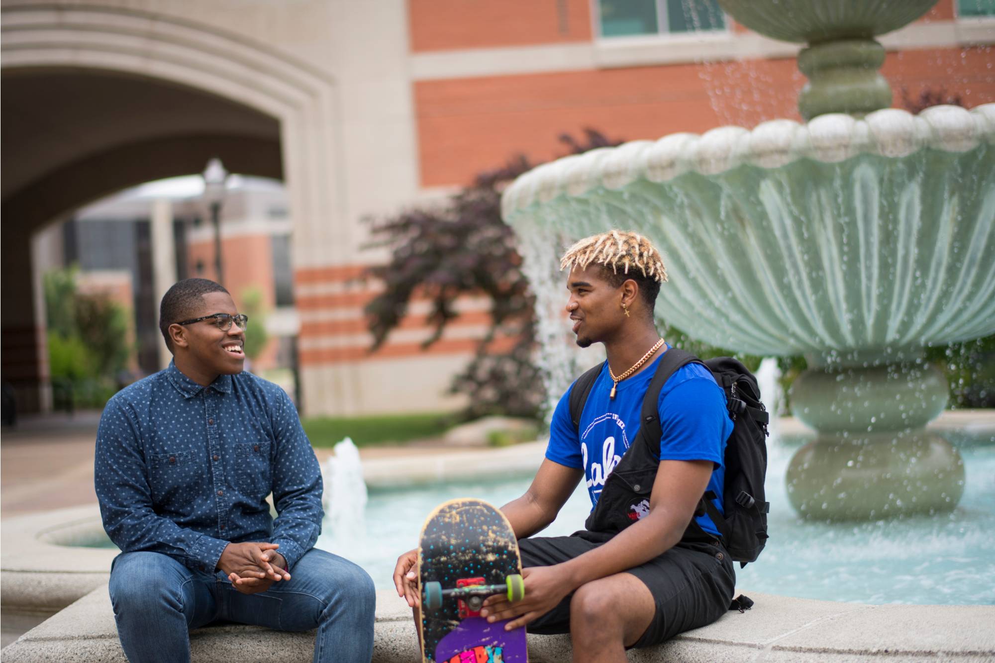 GVSU alumni talks to a current GVSU student on the Allendale campus.